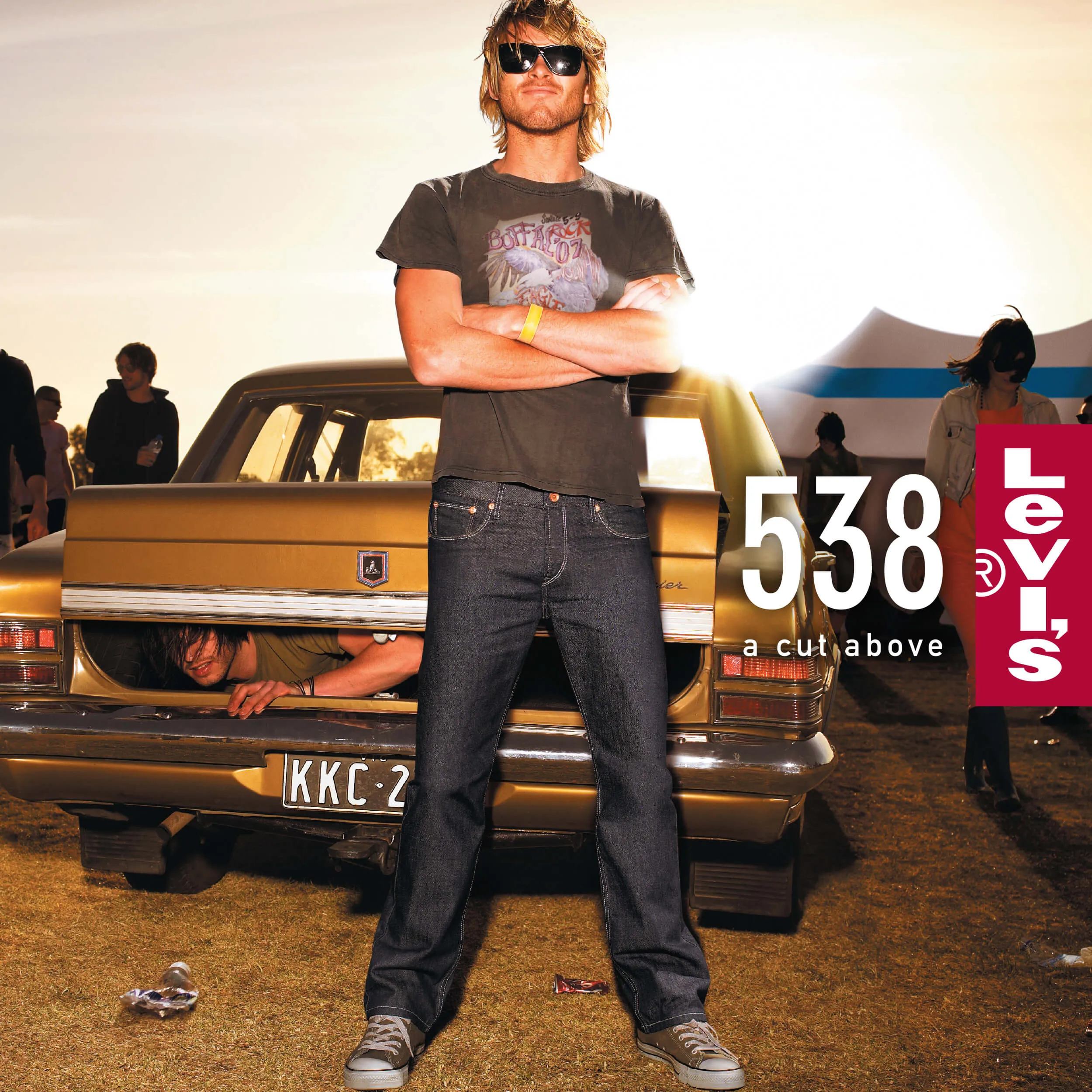 An outdoor advertising poster for Levi's 538 with a music festival theme